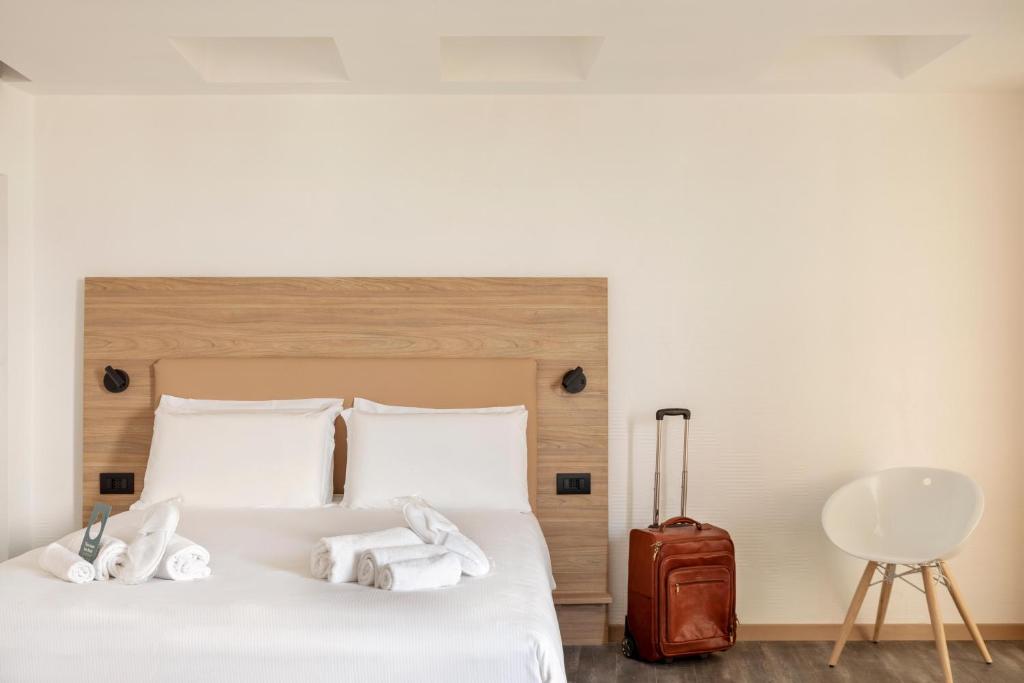 Postel nebo postele na pokoji v ubytování B&B Hotel Pomezia Roma