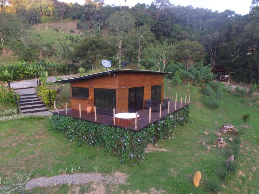 a small house in the middle of a field at El Indio EcoLodge in El Amparo