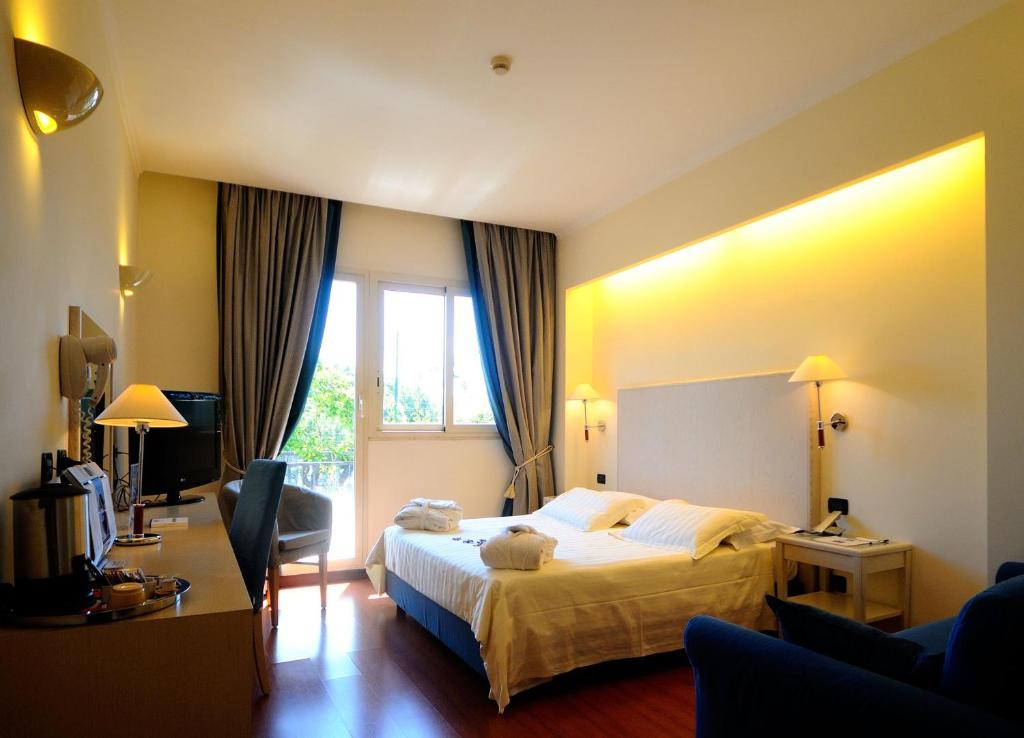 Postel nebo postele na pokoji v ubytování Best Western Hotel Globus