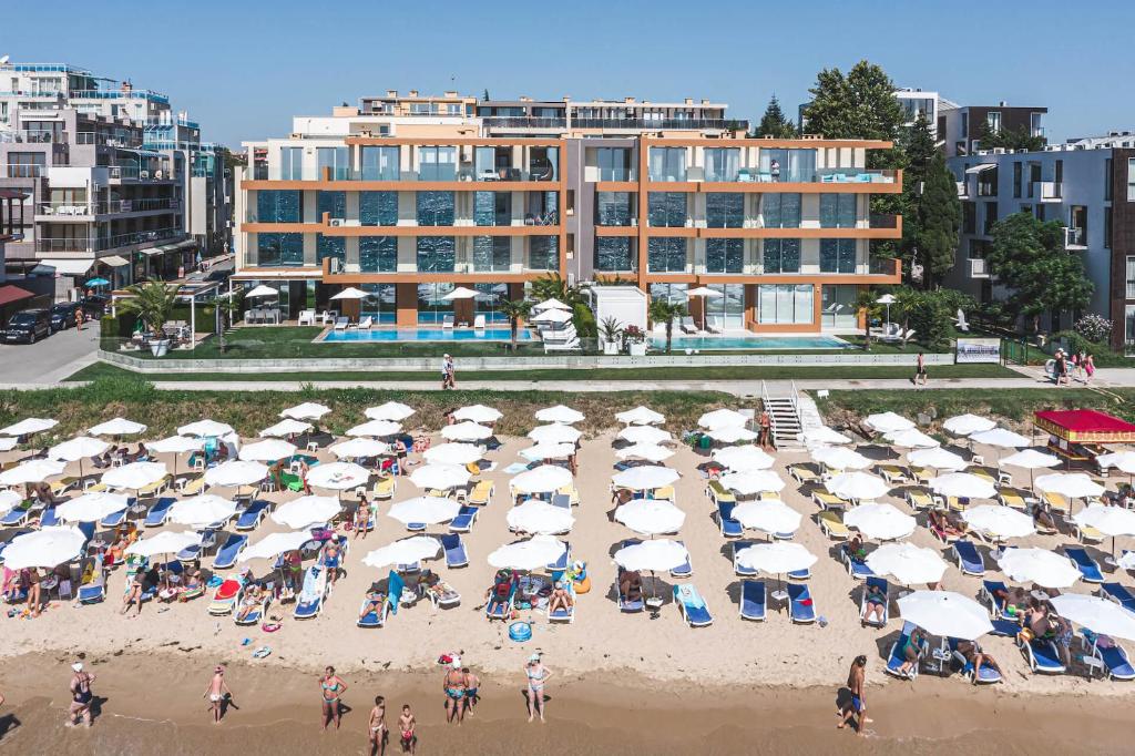 an aerial view of a beach with umbrellas and people at JOY Studio in Ravda