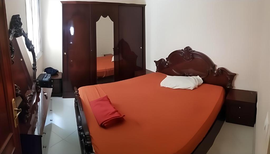 Giường trong phòng chung tại Appartements ahlan