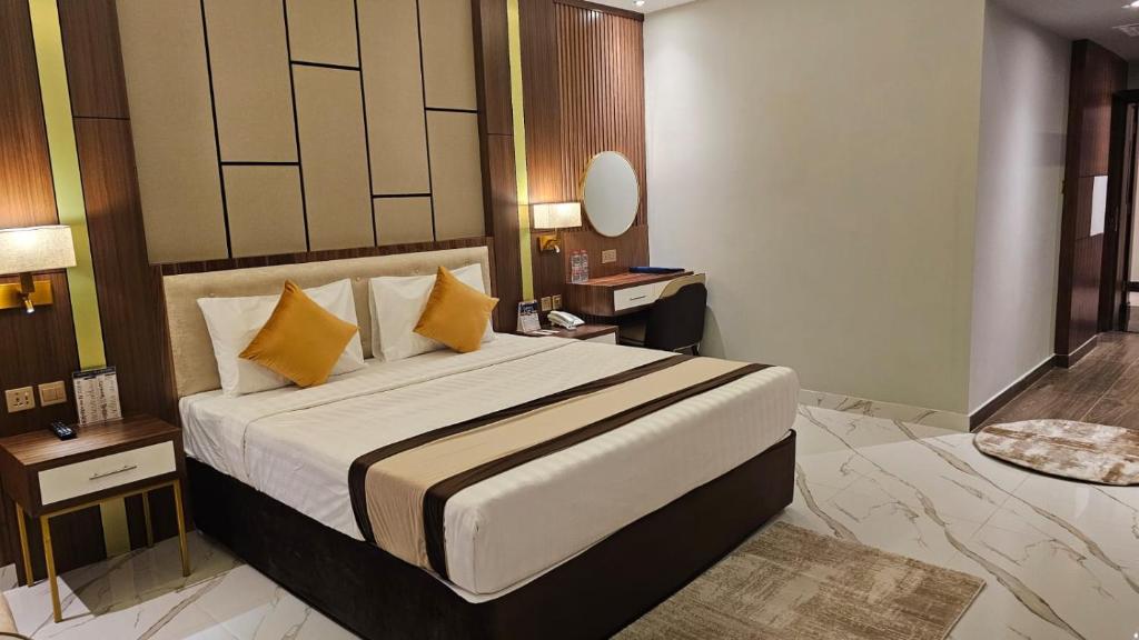 Postel nebo postele na pokoji v ubytování Concorde Deira Hotel -Formerly Golden Tulip Deira Hotel