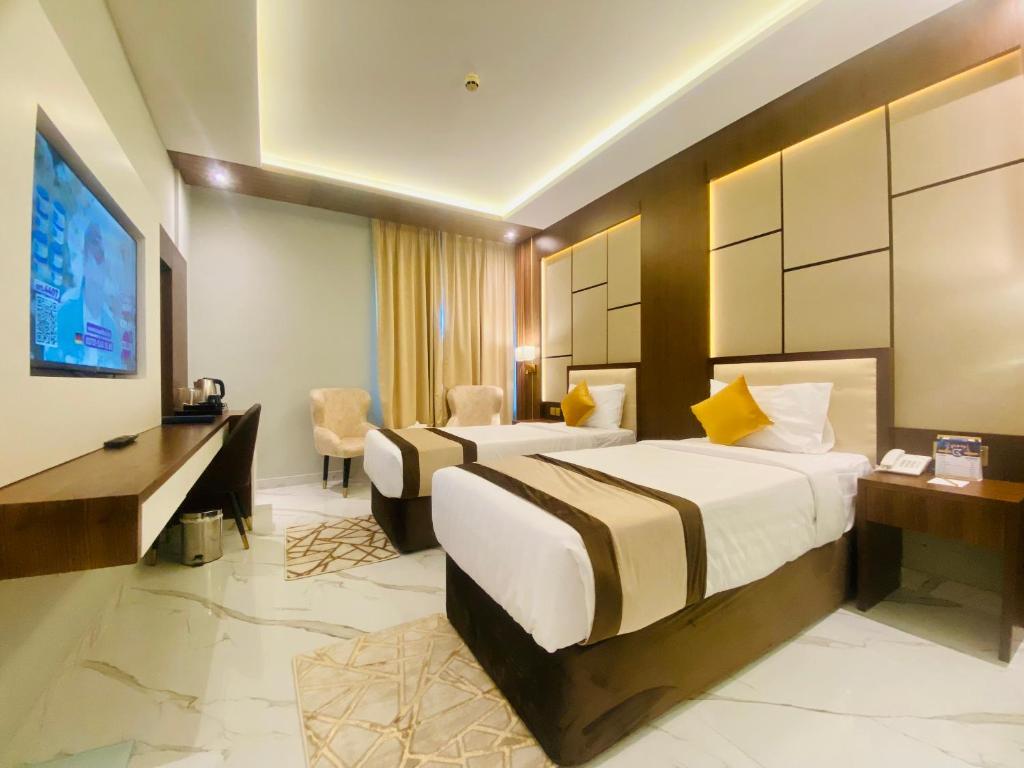 Postel nebo postele na pokoji v ubytování Concorde Deira Hotel -Formerly Golden Tulip Deira Hotel