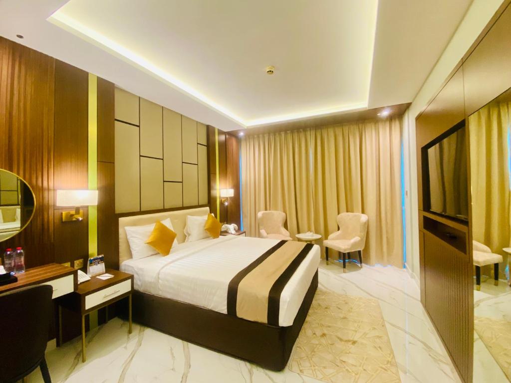 Postel nebo postele na pokoji v ubytování Concorde Deira Hotel -Formerly Golden Tulip Deira Hotel