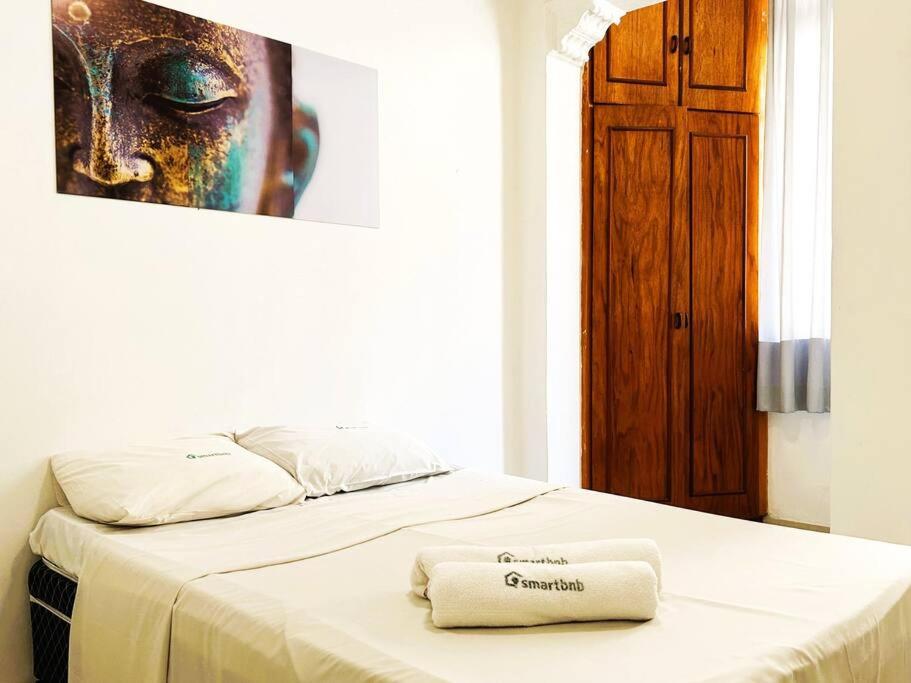 Postel nebo postele na pokoji v ubytování Apartamento na Orla de Copacabana