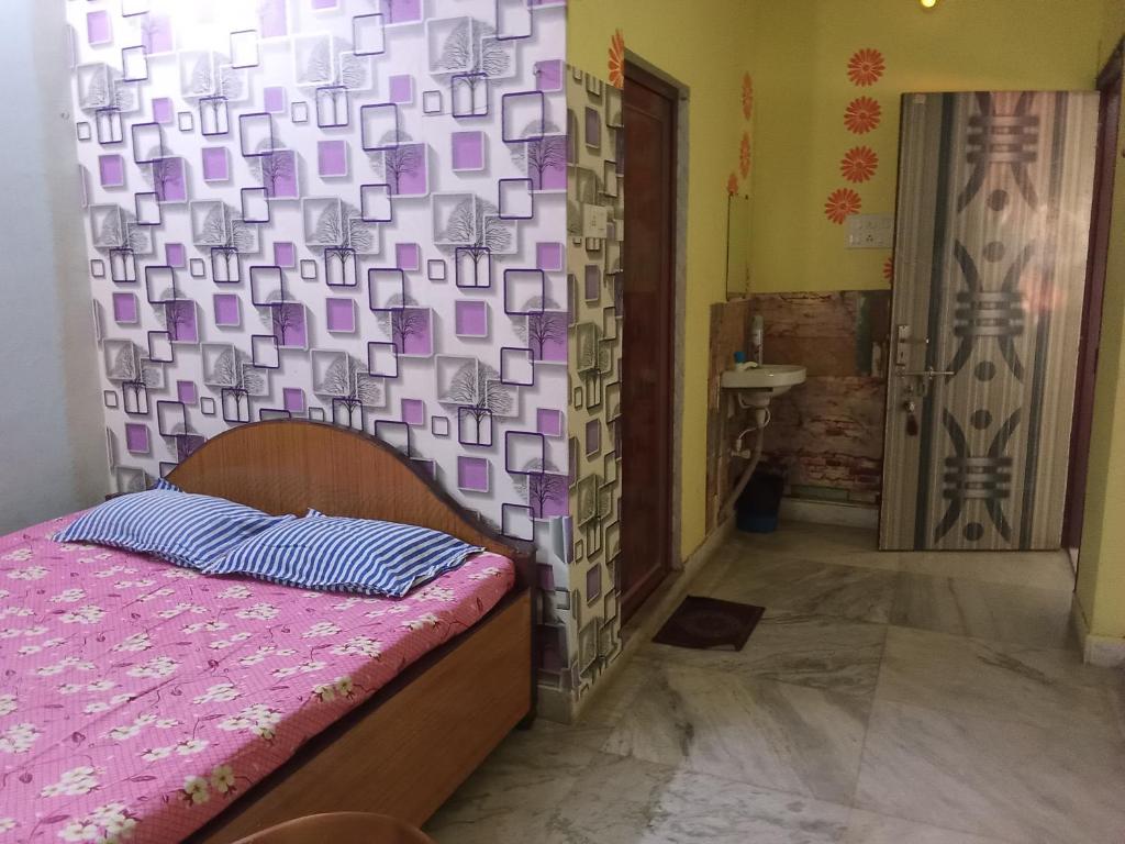Postel nebo postele na pokoji v ubytování Amar priya guest house