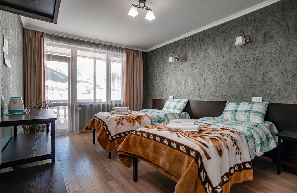 Postel nebo postele na pokoji v ubytování Roza Guesthouse