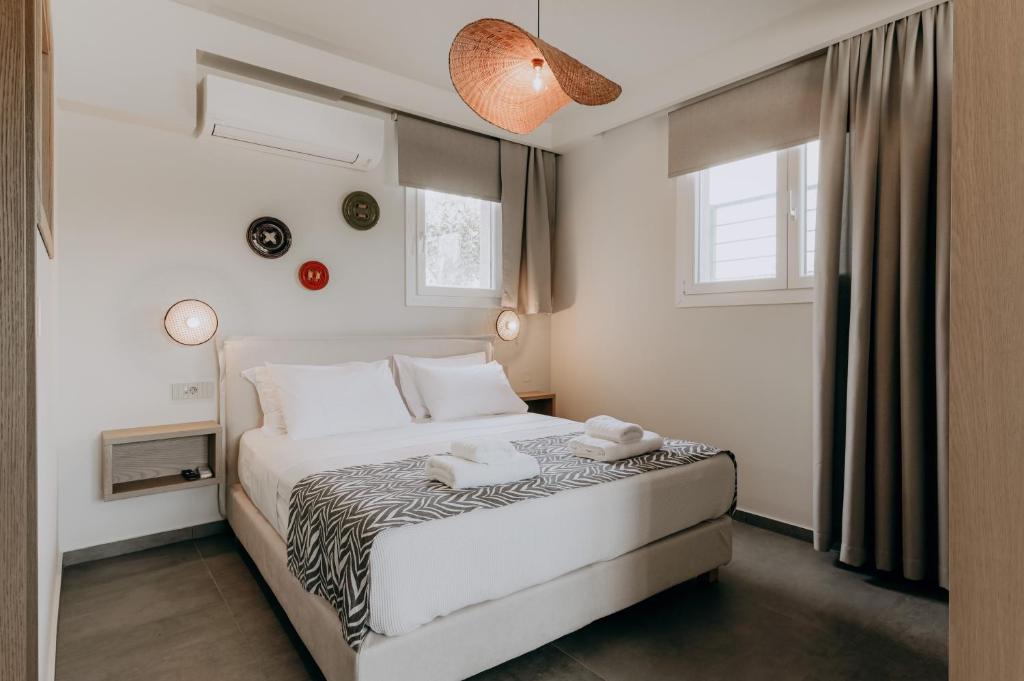 Postel nebo postele na pokoji v ubytování ALS COMFORT SUITES