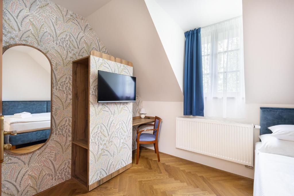 Een TV en/of entertainmentcenter bij Hotel Tanzberg Mikulov

