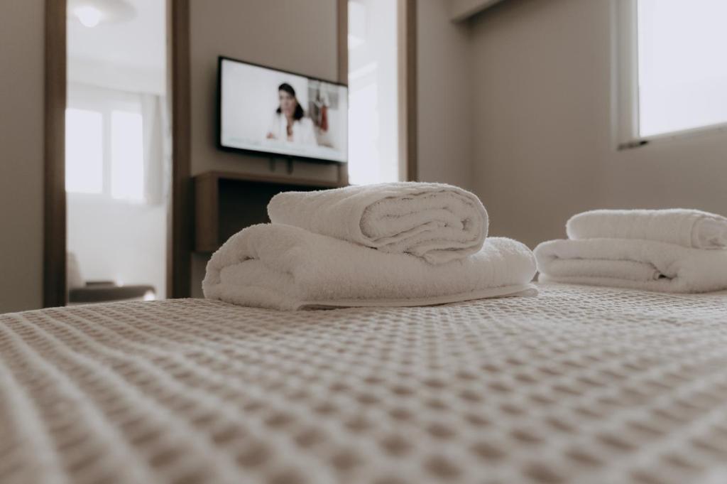 Postel nebo postele na pokoji v ubytování ALS COMFORT SUITES
