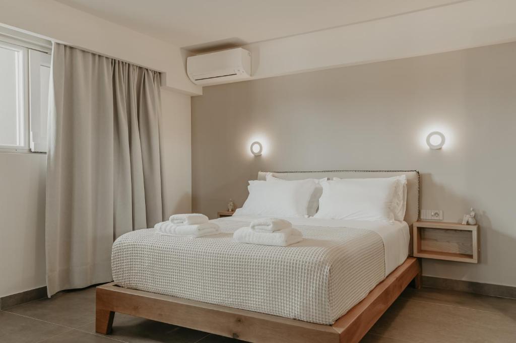 Postel nebo postele na pokoji v ubytování ALS COMFORT SUITES