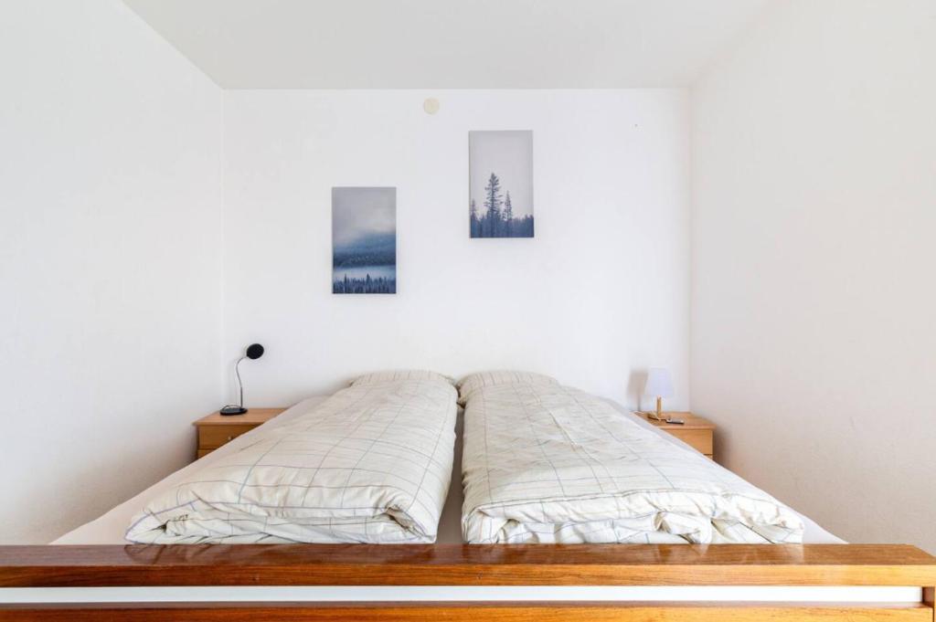 Postel nebo postele na pokoji v ubytování Simple flat in Saas Fee
