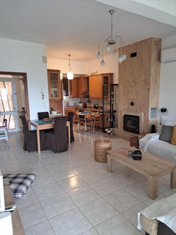 a living room with a couch and a table at Sea Breeze Alexandroupolis in Alexandroupoli
