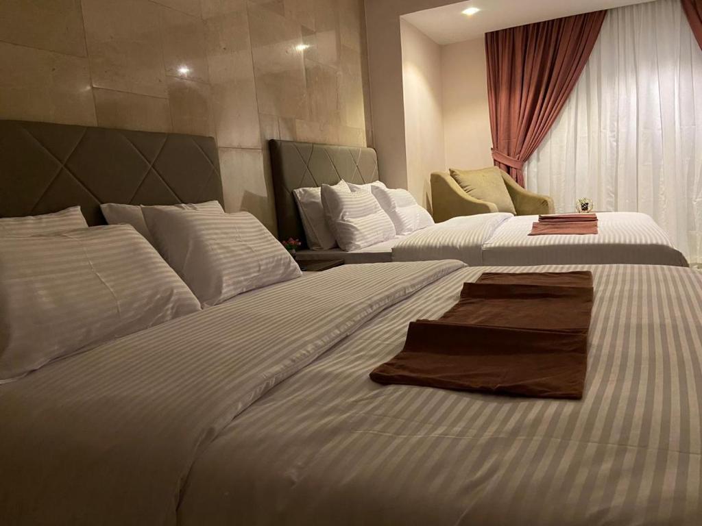 Postel nebo postele na pokoji v ubytování Aziz Egypt Pyramids Hotel