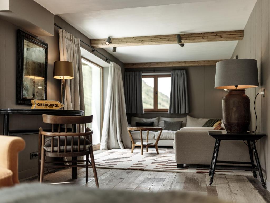 a living room with a couch and a table at Chalet Cecilia by MYALPS in Obergurgl