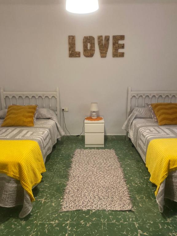 Posteľ alebo postele v izbe v ubytovaní Casita Rural La Rosa de la Huerta con chimenea interior