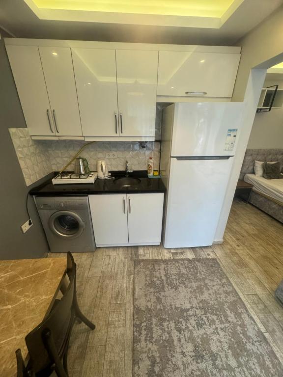 Kuchyň nebo kuchyňský kout v ubytování Arat Apartments