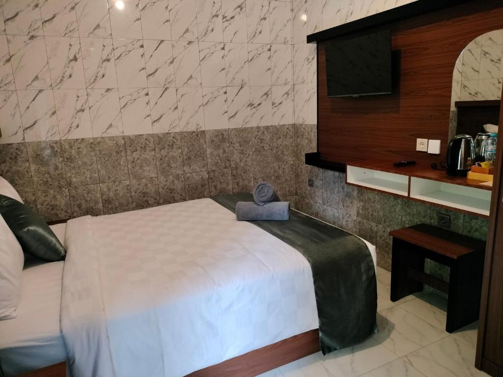 Postel nebo postele na pokoji v ubytování Tirtasuci House