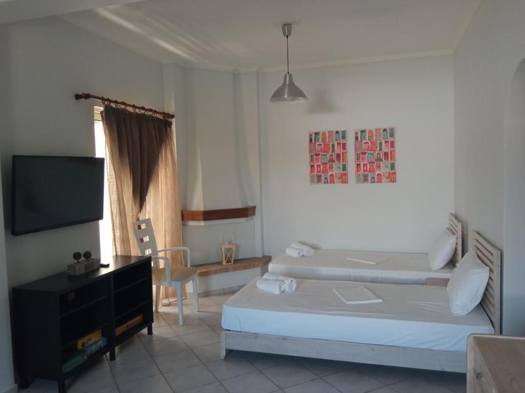 Posteľ alebo postele v izbe v ubytovaní Sea Side House Kourouta