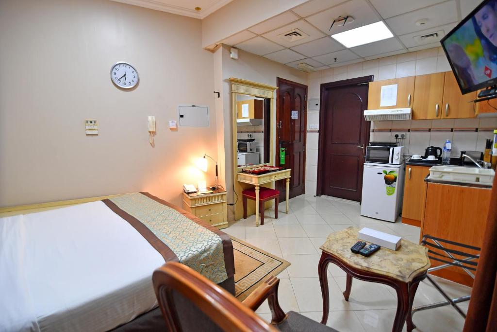 Kuchyň nebo kuchyňský kout v ubytování Emirates Stars Hotel Apartments Sharjah