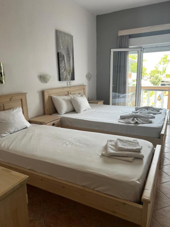 Postel nebo postele na pokoji v ubytování Ellas Hotel