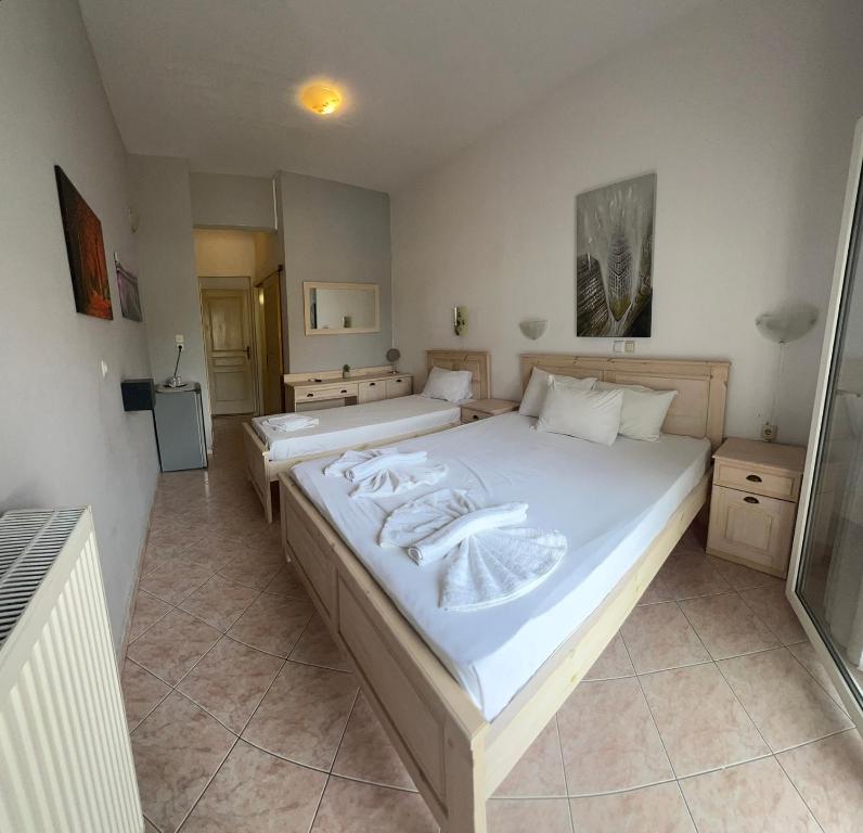 Postel nebo postele na pokoji v ubytování Ellas Hotel