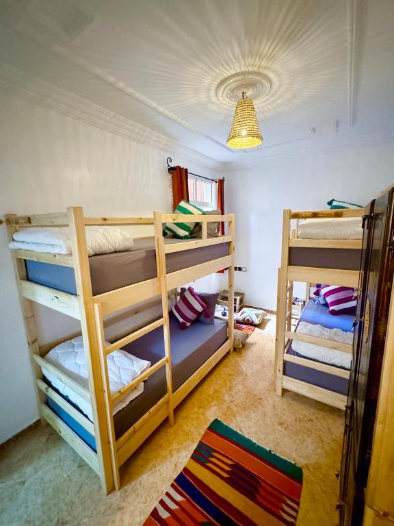 Postel nebo postele na pokoji v ubytování Natural Surf House