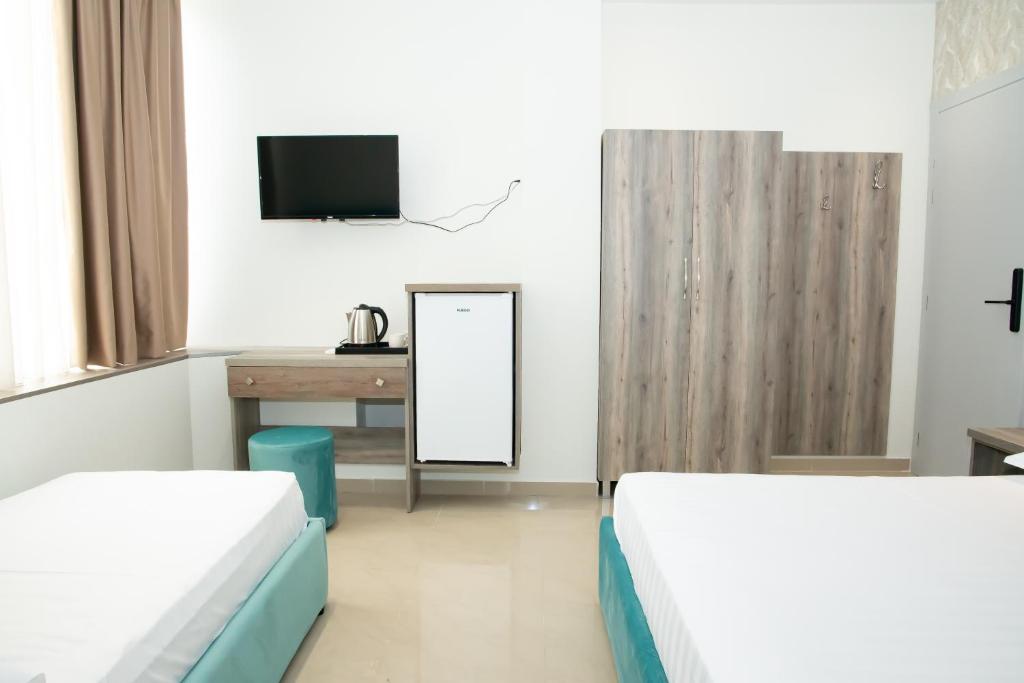 Postel nebo postele na pokoji v ubytování Alv Rent Rooms