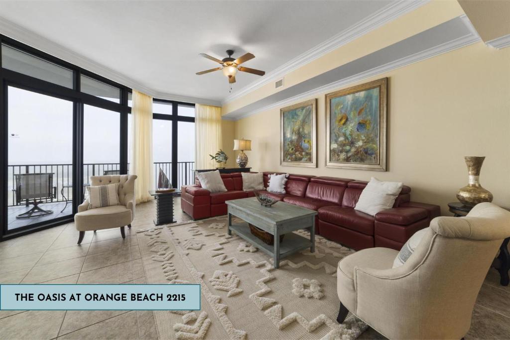 a living room with a couch and a table at The Oasis At Orange Beach 2215 by Liquid Life in Orange Beach