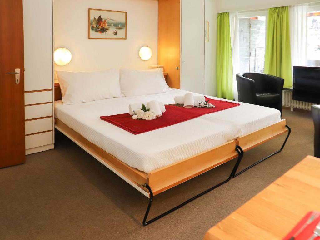 Postel nebo postele na pokoji v ubytování Apartment Matten - Utoring-12 by Interhome