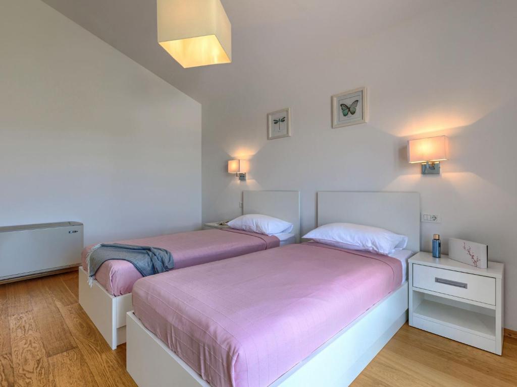 Łóżko lub łóżka w pokoju w obiekcie Villa Luna Rossa by Interhome