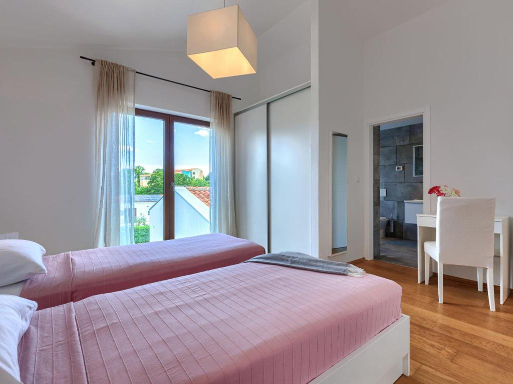 Łóżko lub łóżka w pokoju w obiekcie Villa Luna Rossa by Interhome
