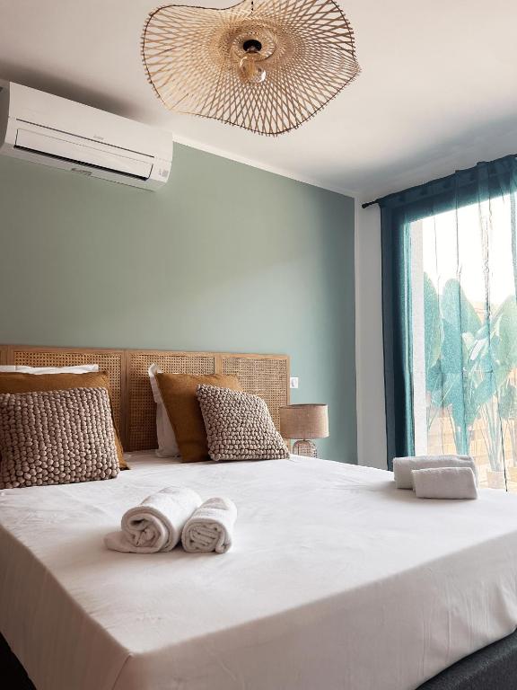 Postel nebo postele na pokoji v ubytování Hôtel A Stretta