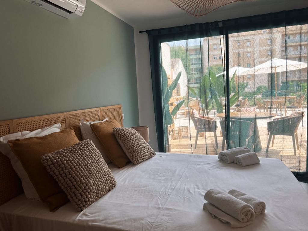 Postel nebo postele na pokoji v ubytování Hôtel A Stretta