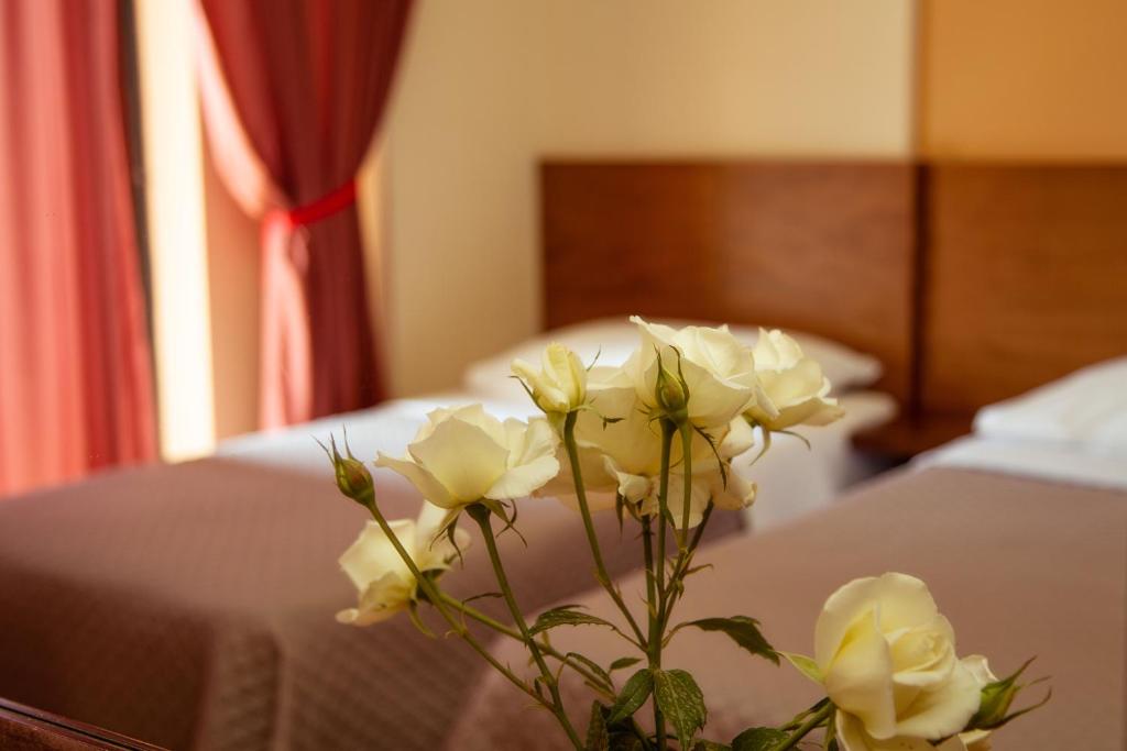 Postel nebo postele na pokoji v ubytování Hotel Giorgio
