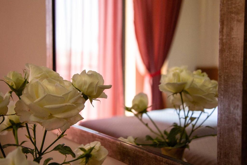 Postel nebo postele na pokoji v ubytování Hotel Giorgio