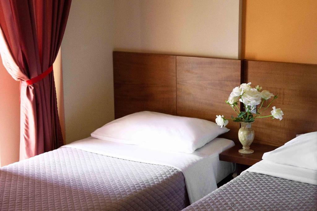 Postel nebo postele na pokoji v ubytování Hotel Giorgio