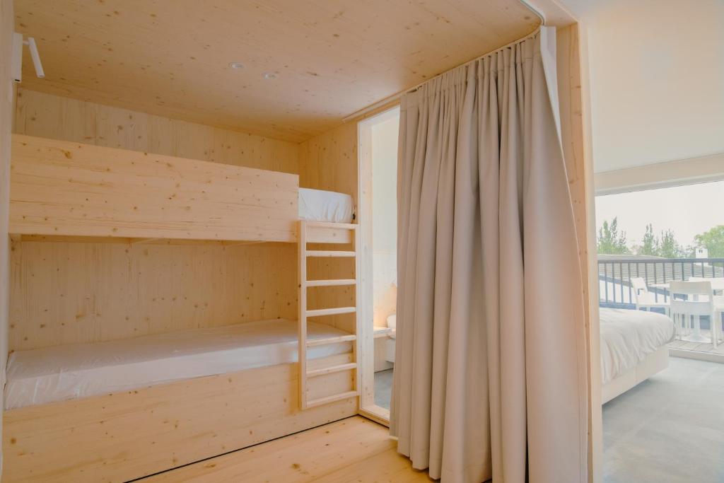 Postel nebo postele na pokoji v ubytování ZAELIG Hotel