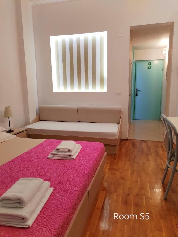 Postel nebo postele na pokoji v ubytování Riva Brela