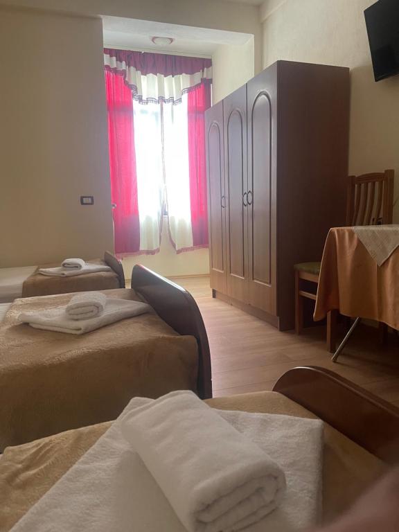 Postel nebo postele na pokoji v ubytování Hotel Saint Marena