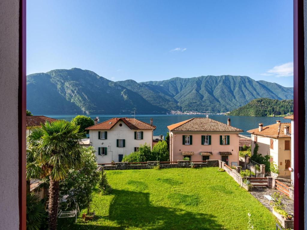 a view of a town with a lake and mountains at Apartment Regina 29 by Interhome in Mezzegra