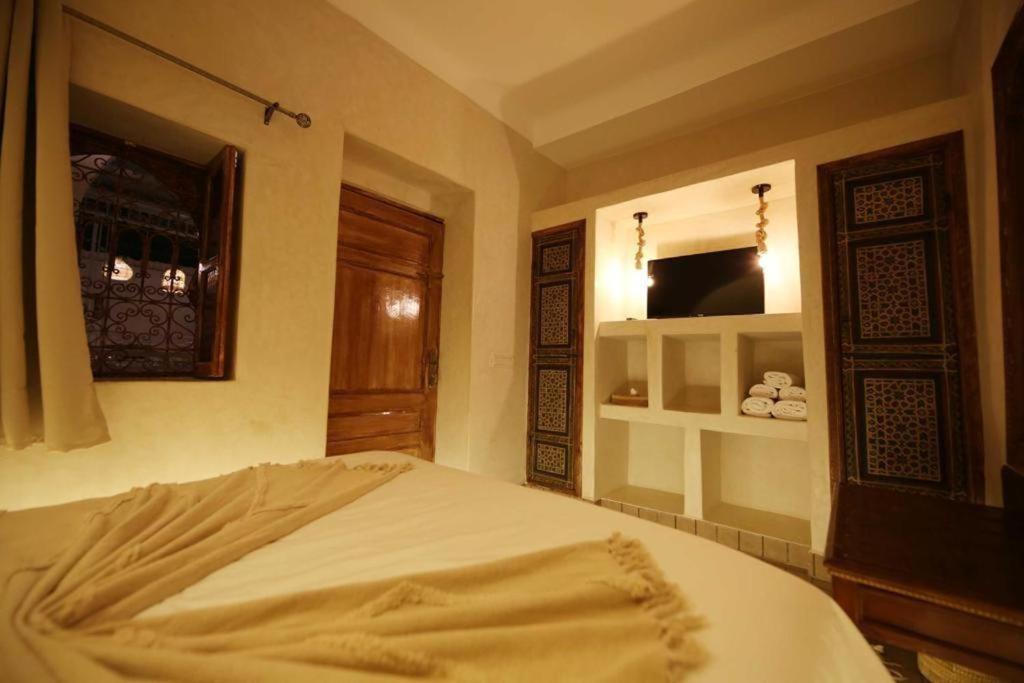 Postel nebo postele na pokoji v ubytování Riad Oum Exclusive