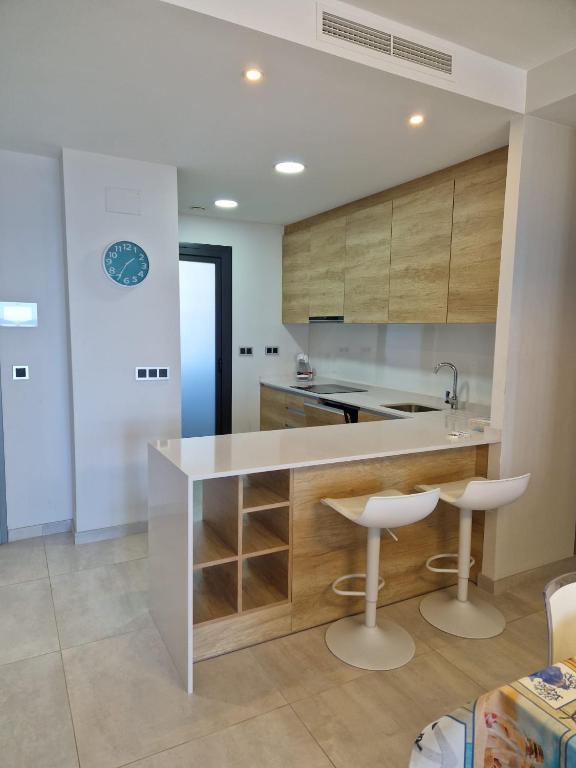 Kuchyň nebo kuchyňský kout v ubytování Apartment Sunset Waves Poniente