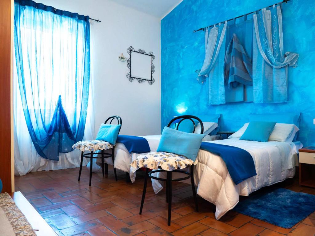 Posteľ alebo postele v izbe v ubytovaní B&B Aesis La Dolce Collina