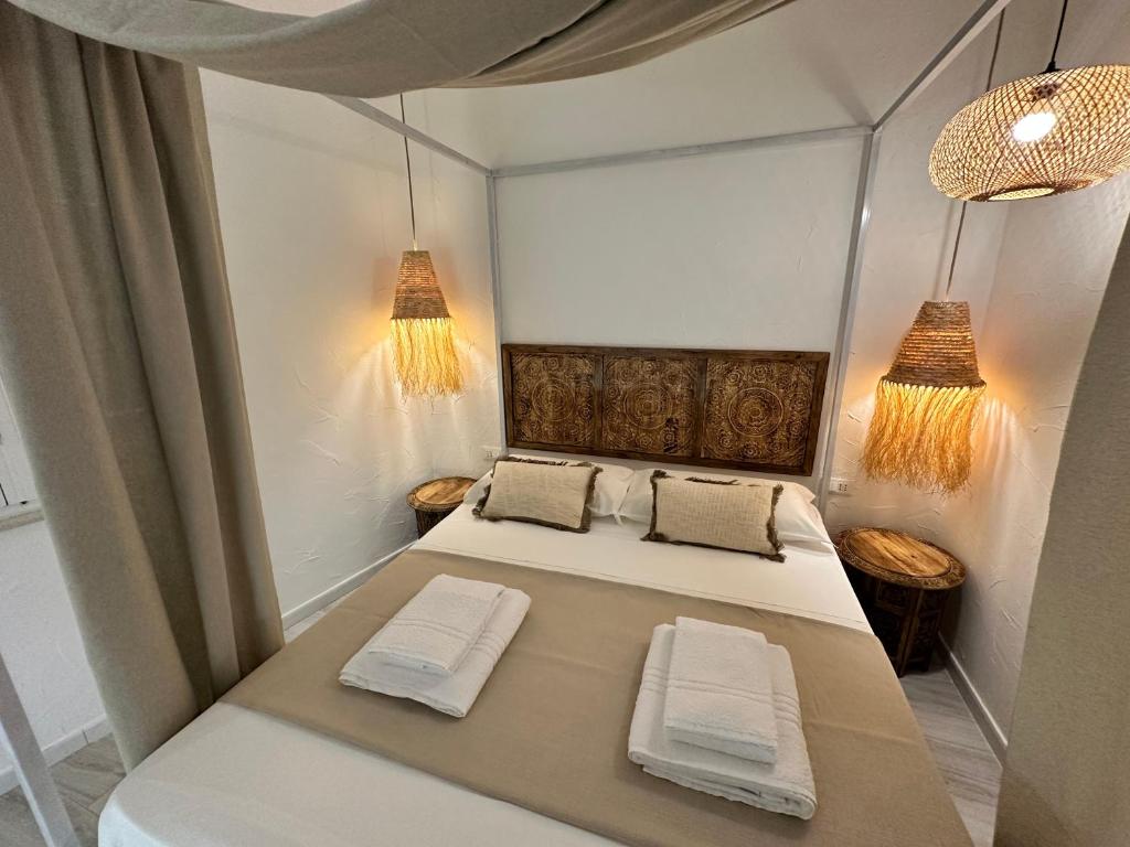 Postel nebo postele na pokoji v ubytování Rada room&suite