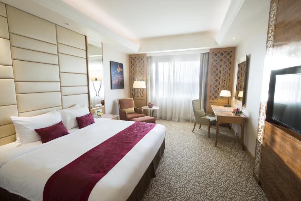 Ένα ή περισσότερα κρεβάτια σε δωμάτιο στο Sedona Hotel Yangon