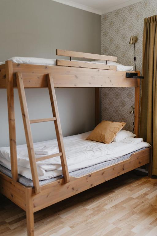 Postel nebo postele na pokoji v ubytování Vassbo Vandrarhem