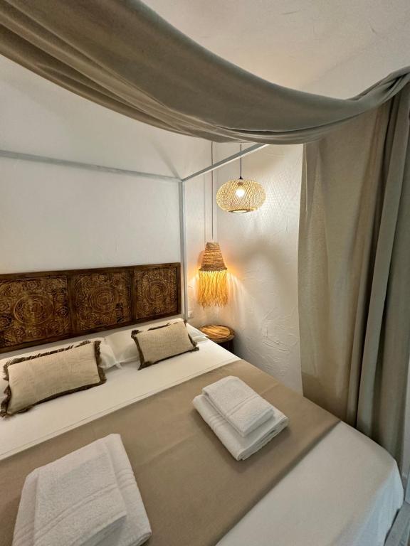 Postel nebo postele na pokoji v ubytování Rada room&suite