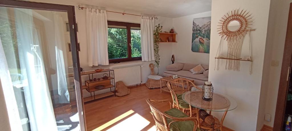 a living room with a table and a couch at Ferienhaus Pieschl in Keutschach am See