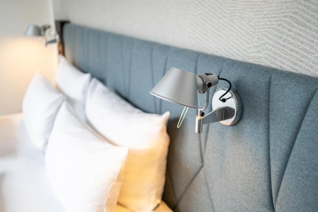 Postel nebo postele na pokoji v ubytování Motel One Brussels